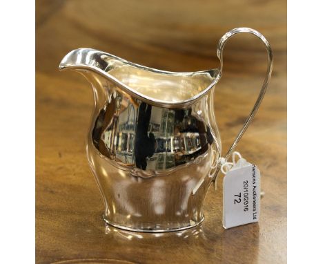 A helmet shaped silver cream jug, hallmark Sheffield 1904, maker Pearce and Sons, weight approx 118 grams/3.79 ozt (1) 