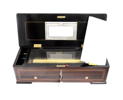A 19th Century Swiss musical box, signed Ducommum Girod on top of the brass winding lever, also stamped 3307 and a second ser