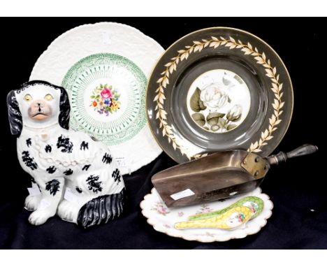 A Staffordshire Spaniel (19th Century) with separate front leg, three decorative plates to include Royal Worcester, a pair of