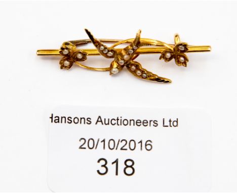 An Edwardian 15ct seed pearl set bar brooch in the form of a swallow, approx 41 mm, gross weight approx 2.9 grams
