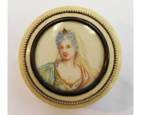  A 19th Century circular ivory lidded box, the pull-off lid inset with a portrait miniature of a lady in 18th Century costume