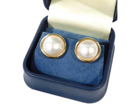A pair of 18ct gold and blister pearl clip earrings, in circular gold mounts, boxed, 7.9g