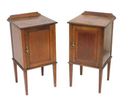 A pair of Edwardian mahogany pot cupboards, with satinwood crossbanding and line inlay, with a single door opening to reveal 