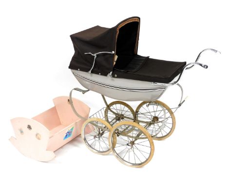 A Silver Cross pram, with a grey chassis and brown fabric hood and child protector, 94cm long, together with a pink painted w