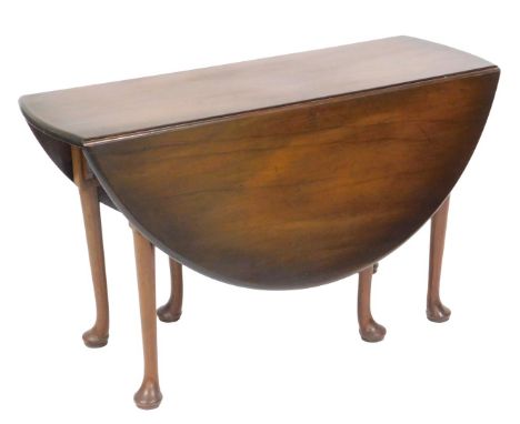 A George III mahogany gate leg dining table, raised on turned legs and pad feet, 70cm high, 118cm wide, 44cm deep, 128.5cm ex
