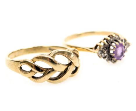 A 9ct gold amethyst and CZ ring, size O, and a 9ct gold ring in a pierced interlocking design, size P, 4.6g.