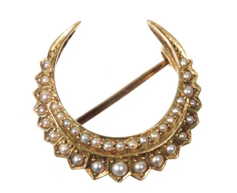 A Victorian seed pearl set crescent moon brooch, in yellow metal, stamped 15ct, 3.4g.
