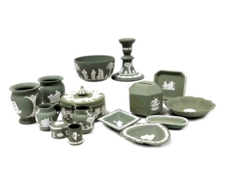 A group of Wedgwood green Jasperware, including a hexagonal money box, bowl, vases, dressing table box and cover, candlestick