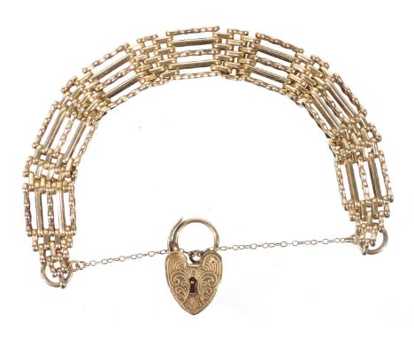 A 9ct gold five bar gate bracelet, on a heart shaped padlock clasp, with safety chain as fitted, 23.6g.