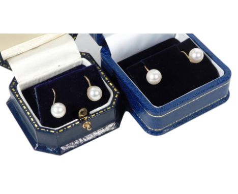 Two pairs of 9ct gold and cultured pearl single earrings, on hoop and screw attachments, boxed.