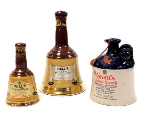 A Grant's Deluxe Scotch Whisky, in a two tone pottery bottle with stopper, together with a Bells Specially Old Scotch Whisky,
