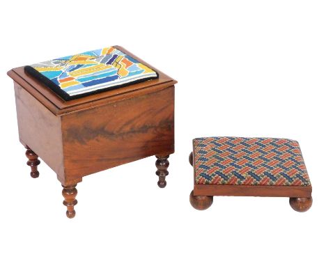 A Victorian mahogany commode stool, the hinged lid with a woolwork seat, opening to reveal an inner lid and ceramic bucket, r