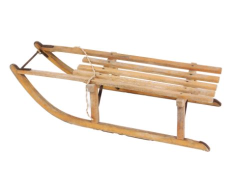 A vintage Greys of Cambridge Tabos single sledge, 95cm long.