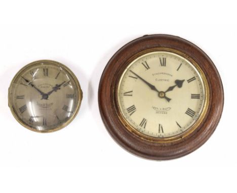 Synchronome electric 7" wall dial slave clock, within a turned oak surround; also another Synchronome electric 5" wall dial s