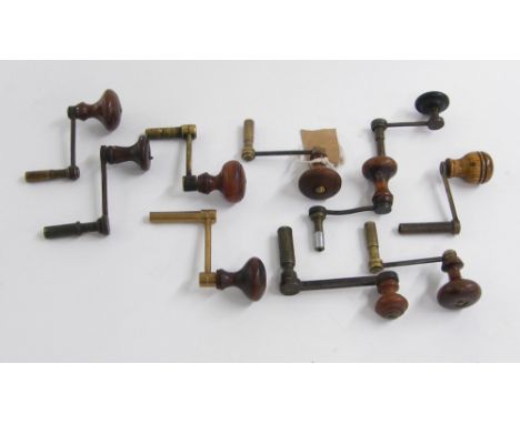 Ten brass crank clock winding keys with turned wooden handles (10)