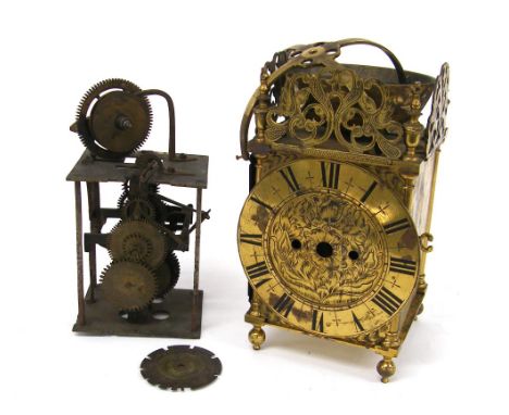 Old brass lantern clock case, the 6.5" dial enclosing a foliate engraved centre and surmounted by pierced foliate frets, turn