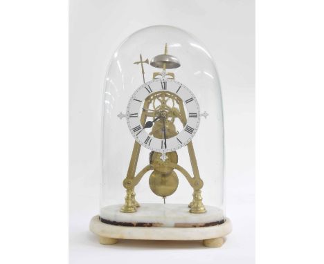 Brass single fusee skeleton clock with passing strike on a bell, the 5.75" white painted chapter ring enclosing a skeletonise