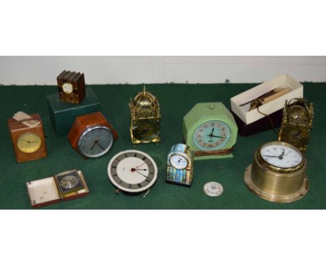 Collection of various contemporary and older electric mantel and other electric clocks, including two contemporary brass lant