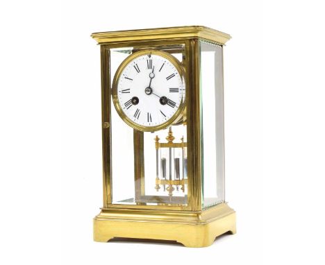 Small French brass four glass two train mantel clock striking on a bell, the 3" white dial within a bevelled glazed stepped c