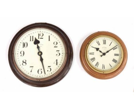Synchronome electric 10" wall dial slave clock, within an oak turned surround; also another Synchronome electric 7" wall dial