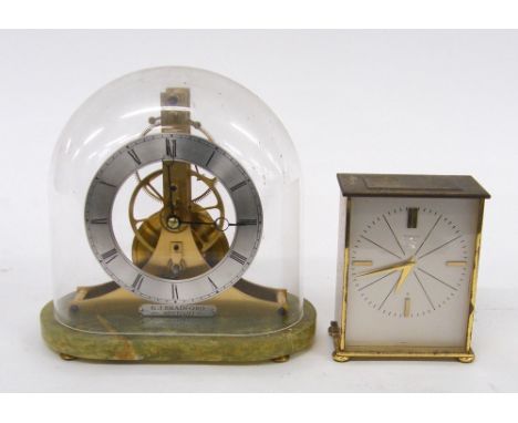 Contemporary brass and green onyx great wheel skeleton clock stamped with the maker's trademark logo KJB, under a plastic dom