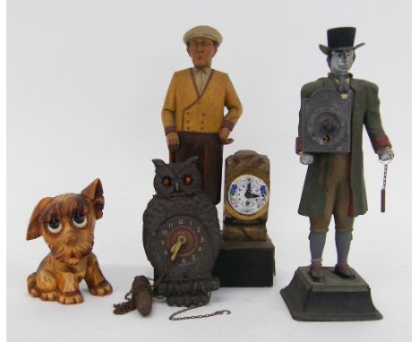Novelty painted cast iron pedlar clock gentleman, 14.5" high; also a novelty carved wooden golfer mantel timepiece, 14.75" hi