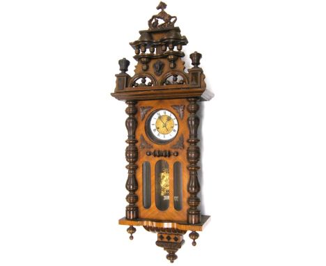 Unusual walnut Vienna regulator style two train wall clock with small musical movement, the 5" white chapter ring enclosing a