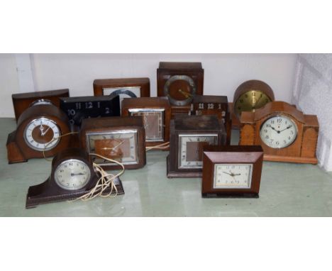 Ten wooden cased electric mantel clocks by various makers, including Symclock, Telavox, Mainstime and other makers (10)