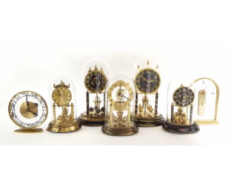 Five various contemporary torsion mantel clocks under glass domes, tallest 12" high; also two other contemporary quartz mante