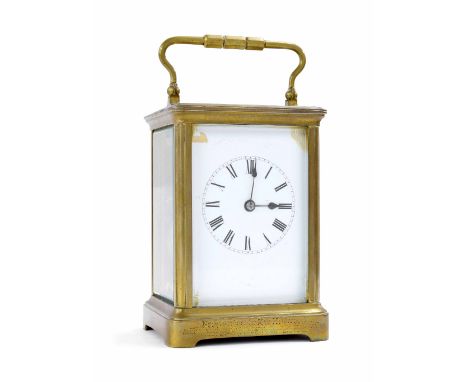Carriage clock striking on a gong, within a corniche brass case, 7" high