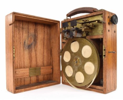Interesting oak cased electrically driven tape reel, inscribed on a rectangular brass plaque inside the lid 'The Shortt Speed