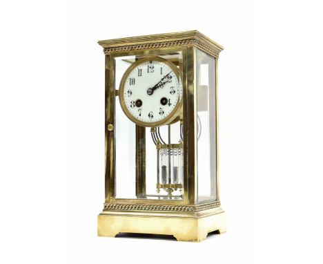 French brass four glass two train mantel clock striking on a gong, the 3.25" cream dial within a bevelled glazed stepped case