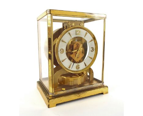 Jaeger LeCoultre Atmos clock, the 4.25" white chapter ring enclosing a skeletonised centre, no. 354201, within a brushed bras