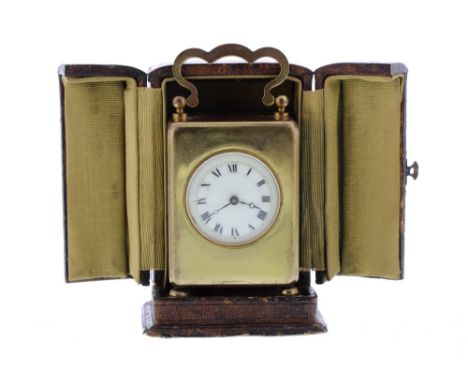 French miniature brass cased carriage clock timepiece, 3.5" high, within a folding Morocco travelling case (key)