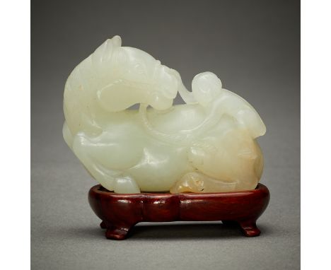 Chinese pale jade carving depicting a monkey climbing onto the back of a horse. A very high quality of modeling, polishing, a