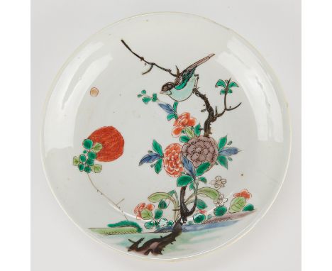 Chinese famille verte porcelain saucer decorated with a bird perched on a branch surrounded by blooming flowers, 18th-19th ce