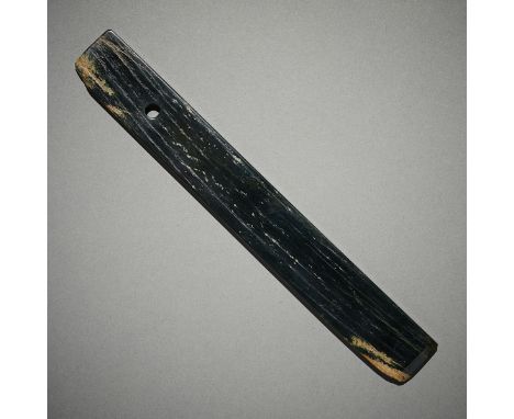 Early Chinese carved jade blade carved in an a elongated form with a single hole near the top. The blade made from a fine dar