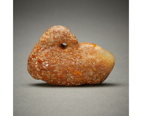 Likely archaic Chinese carved jade pendant in the form of a goose. With a dusty brown irregular surface along the body of the
