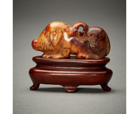 Chinese carved jade pig pendant or toggle. The coloration of stone suggests perhaps some early 19th century treatment. This p