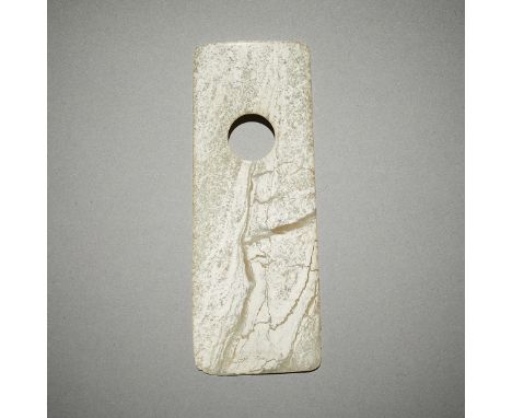 Archaic Chinese carved white jade axe. Pierced with a single large hole and made from a translucent stone.Provenance: Private