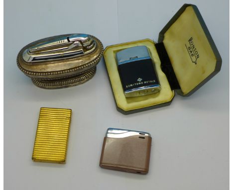 A Dupont lighter, serial number 16HDR29 and three others
