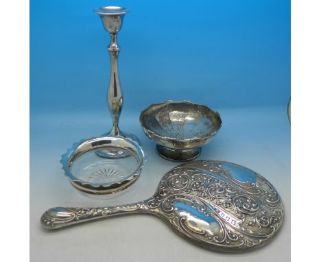 A silver bowl, 133g, a silver candlestick, a silver rimmed bowl and a silver backed mirror