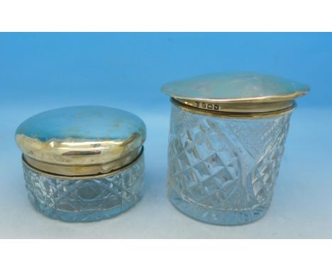 Two silver topped jars