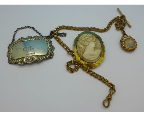 A gold plated cameo brooch, a plated Albert chain and a silver 'Gin' label