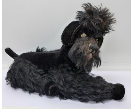 A Steiff soft toy black poodle