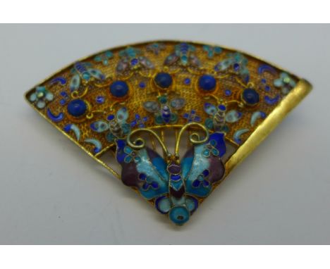 A silver and enamel fan brooch