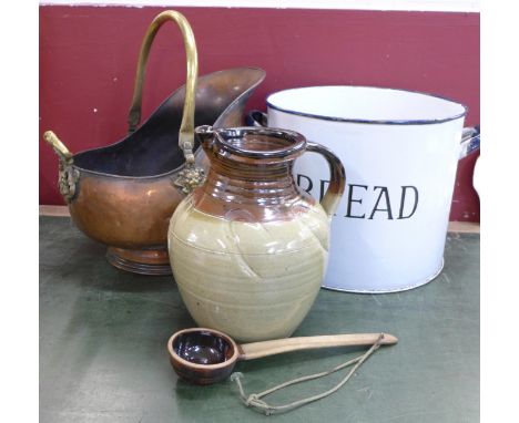 A brass log bucket, an enamel bread bin lacking top and a large stoneware flagon with serving spoon