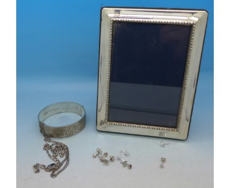 A silver photograph frame, silver bangle and other silver jewellery, frame 15cm x 11.5cm