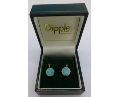 A pair of opal set screw back earrings