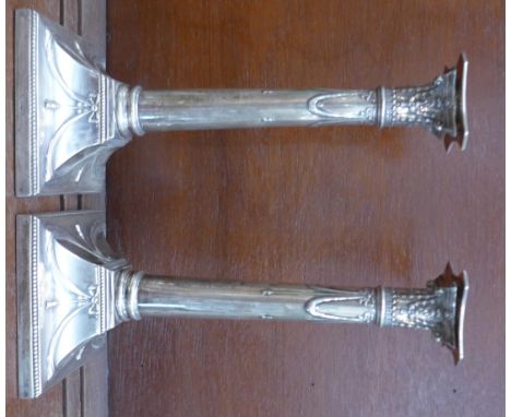 A pair of silver candlesticks, hallmark worn, 29.5cm